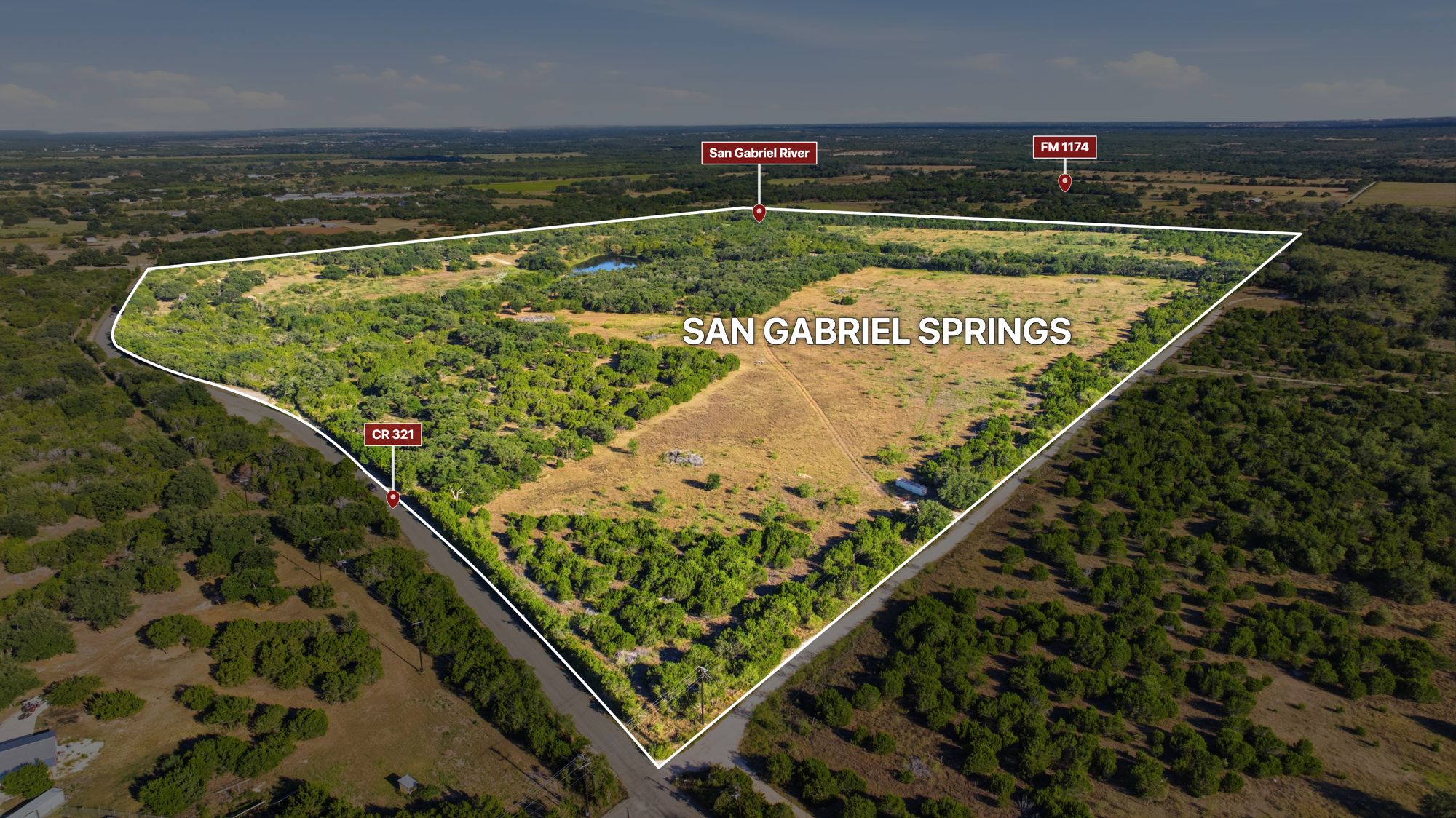 Aerial view of the San Gabriel Springs boundary between County Road 321 and the San Gabriel River, with FM 1174 beyond